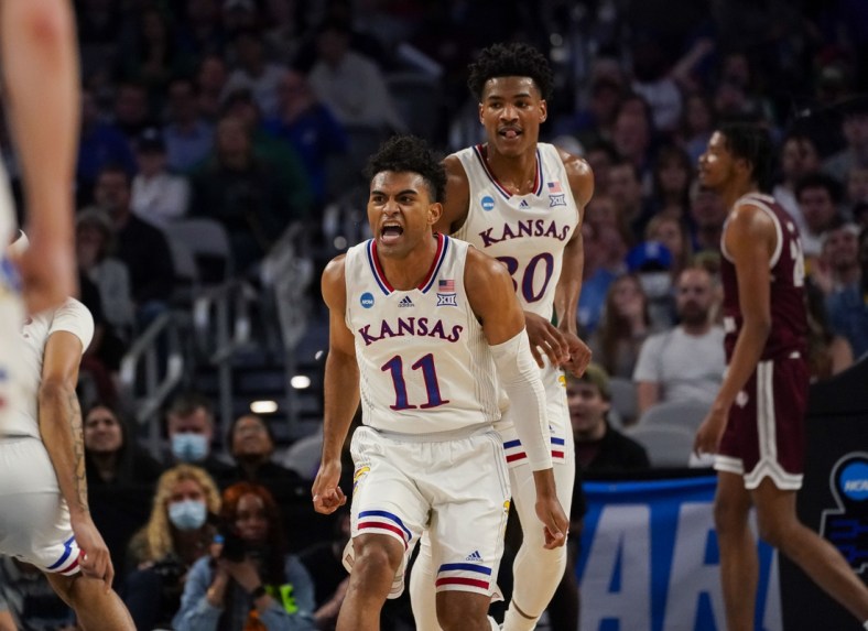 Mar 17, 2022; Fort Worth, TX, USA; Kansas Jayhawks guard Remy Martin (11) and guard Ochai Agbaji (30) celebrates during the first half against the Texas Southern Tigers in the first round of the 2022 NCAA Tournament at Dickies Arena. Mandatory Credit: Chris Jones-USA TODAY Sports