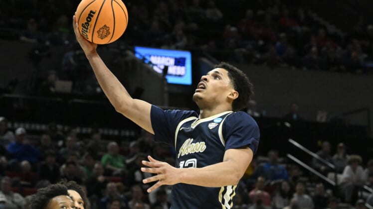 Mar 17, 2022; Portland, OR, USA; Akron Zips guard Xavier Castaneda (13) shoots the basketball against the UCLA Bruins during the second half during the first round of the 2022 NCAA Tournament at Moda Center. Mandatory Credit: Troy Wayrynen-USA TODAY Sports
