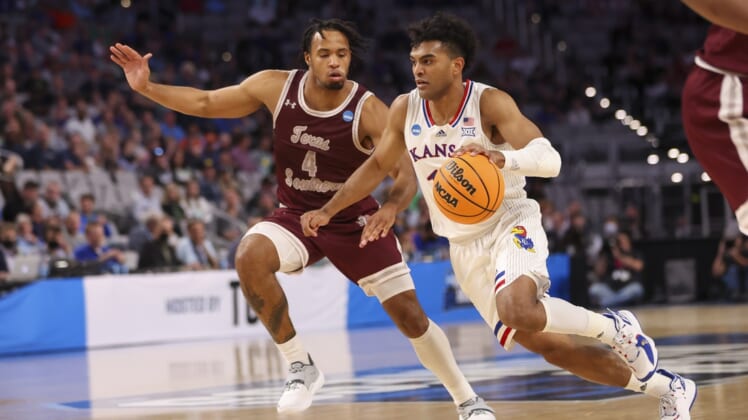 Mar 17, 2022; Fort Worth, TX, USA; Kansas Jayhawks guard Remy Martin (11) durables the ball past Texas Southern Tigers guard Bryson Etienne (4) during the first half in the first round of the 2022 NCAA Tournament at Dickies Arena. Mandatory Credit: Kevin Jairaj-USA TODAY Sports