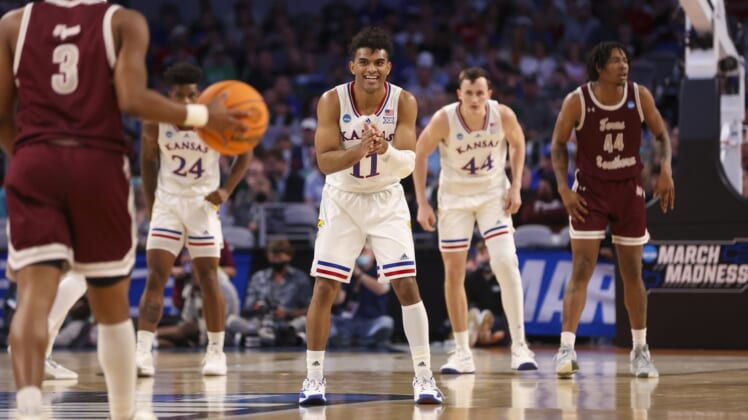 Mar 17, 2022; Fort Worth, TX, USA; Kansas Jayhawks guard Remy Martin (11) smiles as he faces the Texas Southern Tigers during the first half in the first round of the 2022 NCAA Tournament at Dickies Arena. Mandatory Credit: Kevin Jairaj-USA TODAY Sports