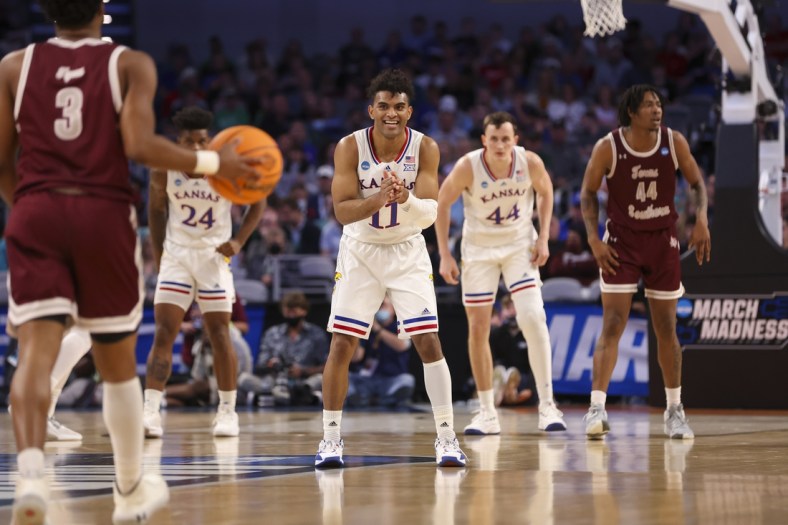Mar 17, 2022; Fort Worth, TX, USA; Kansas Jayhawks guard Remy Martin (11) smiles as he faces the Texas Southern Tigers during the first half in the first round of the 2022 NCAA Tournament at Dickies Arena. Mandatory Credit: Kevin Jairaj-USA TODAY Sports