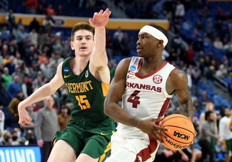 Mar 17, 2022; Buffalo, NY, USA; Arkansas Razorbacks guard Davonte Davis (4) drives against Vermont Catamounts guard Finn Sullivan (15) in the second half during the first round of the 2022 NCAA Tournament at KeyBank Center. Mandatory Credit: Mark Konezny-USA TODAY Sports