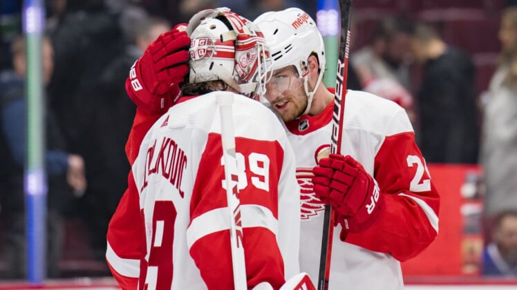 Mar 17, 2022; Vancouver, British Columbia, CAN; Detroit Red Wings goalie Alex Nedeljkovic (39) and forward Pius Suter (24) celebrate their victory against the Vancouver Canucks at Rogers Arena. Detroit won 1-0. Mandatory Credit: Bob Frid-USA TODAY Sports
