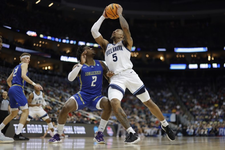 Mar 18, 2022; Pittsburgh, PA, USA;  Villanova Wildcats guard Justin Moore (5) drives to the basket second down defenders in the second half during the first round of the 2022 NCAA Tournament at PPG Paints Arena. Mandatory Credit: Geoff Burke-USA TODAY Sports