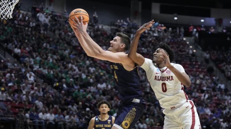 Mar 18, 2022; San Diego, CA, USA; Alabama Crimson Tide forward Noah Gurley (0) defends against Notre Dame Fighting Irish guard Alex Wade (4) in the second half during the first round of the 2022 NCAA Tournament at Viejas Arena. Mandatory Credit: Kirby Lee-USA TODAY Sports
