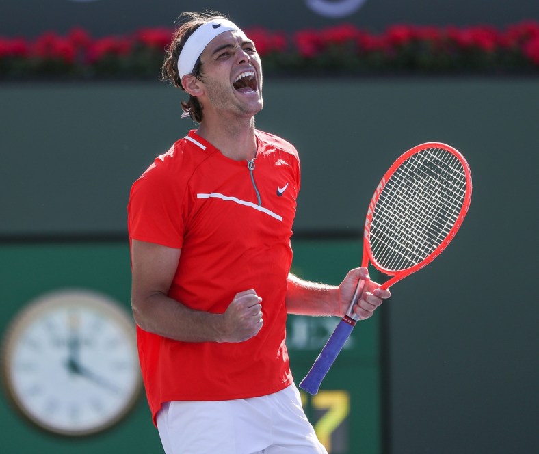 Taylor Fritz celebrates his quarterfinal win over Miomir Kecmanovic during the BNP Paribas Open in Indian Wells, Calif., March 18, 2022.

Bnp Quarterfinals Friday 27