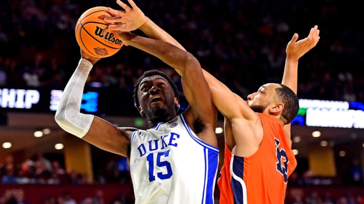 Mar 18, 2022; Greenville, SC, USA; Duke Blue Devils center Mark Williams (15) shoots the ball against Cal State Fullerton Titans forward Vincent Lee (13) during the second half during the first round of the 2022 NCAA Tournament at Bon Secours Wellness Arena. Mandatory Credit: Bob Donnan-USA TODAY Sports