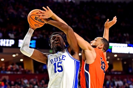 Mar 18, 2022; Greenville, SC, USA; Duke Blue Devils center Mark Williams (15) shoots the ball against Cal State Fullerton Titans forward Vincent Lee (13) during the second half during the first round of the 2022 NCAA Tournament at Bon Secours Wellness Arena. Mandatory Credit: Bob Donnan-USA TODAY Sports