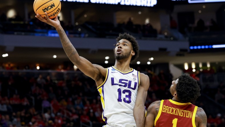 Mar 18, 2022; Milwaukee, WI, USA; LSU Tigers forward Tari Eason (13) drives to the basket against Iowa State Cyclones guard Izaiah Brockington (1) in the first half during the first round of the 2022 NCAA Tournament at Fiserv Forum. Mandatory Credit: Jeff Hanisch-USA TODAY Sports