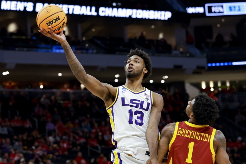Mar 18, 2022; Milwaukee, WI, USA; LSU Tigers forward Tari Eason (13) drives to the basket against Iowa State Cyclones guard Izaiah Brockington (1) in the first half during the first round of the 2022 NCAA Tournament at Fiserv Forum. Mandatory Credit: Jeff Hanisch-USA TODAY Sports