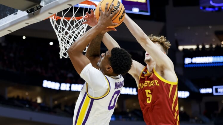 Mar 18, 2022; Milwaukee, WI, USA; LSU Tigers guard Brandon Murray (0) drives to the basket and is blocked by Iowa State Cyclones forward Aljaz Kunc (5) in the first half during the first round of the 2022 NCAA Tournament at Fiserv Forum. Mandatory Credit: Jeff Hanisch-USA TODAY Sports