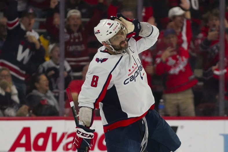 Mar 18, 2022; Raleigh, North Carolina, USA;  Washington Capitals left wing Alex Ovechkin (8) reacts after scoring the game winning goal in the shootout against the  Carolina Hurricanes at PNC Arena. Mandatory Credit: James Guillory-USA TODAY Sports