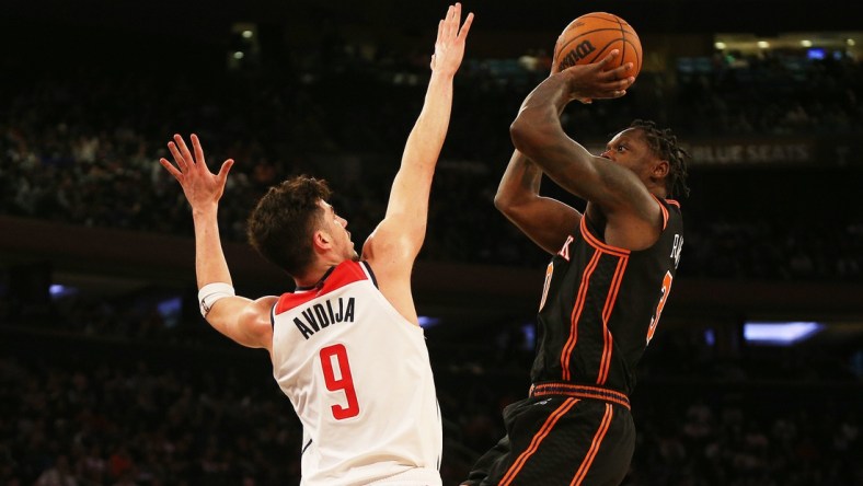 Mar 18, 2022; New York, New York, USA; New York Knicks forward Julius Randle (30) takes a shot against Washington Wizards forward Deni Avdija (9) during the second half at Madison Square Garden. Mandatory Credit: Andy Marlin-USA TODAY Sports