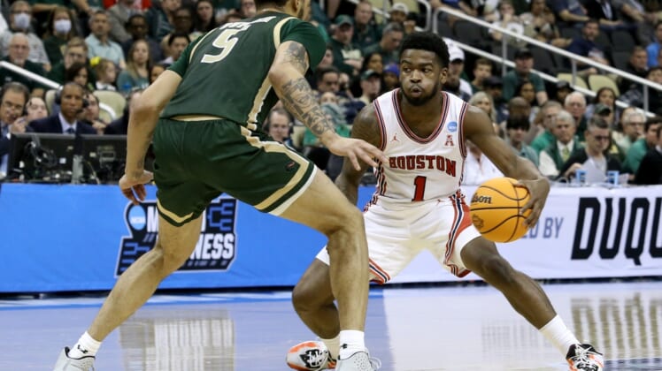 Mar 18, 2022; Pittsburgh, PA, USA; Houston Cougars guard Jamal Shead (1) dribbles against UAB Blazers forward KJ Buffen (5) in the second half during the first round of the 2022 NCAA Tournament at PPG Paints Arena. Mandatory Credit: Charles LeClaire-USA TODAY Sports