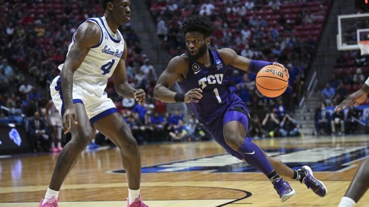Mar 18, 2022; San Diego, CA, USA; TCU Horned Frogs guard Mike Miles (1) dribbles the basketball against Seton Hall Pirates forward Tyrese Samuel (4) during the second half during the first round of the 2022 NCAA Tournament at Viejas Arena. Mandatory Credit: Orlando Ramirez-USA TODAY Sports