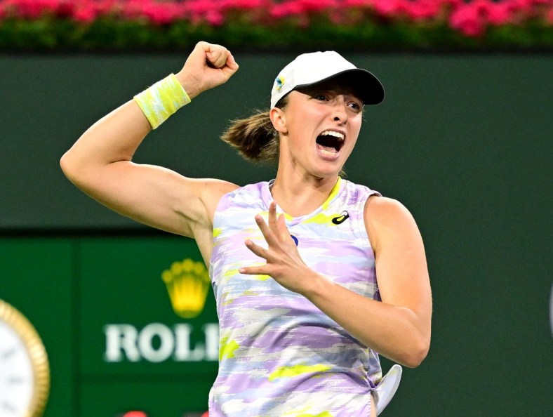 Mar 18, 2022; Indian Wells, CA, USA; Iga Swiatek (ITA) hits a shot as she defeated Simona Halep (ROM) in her semifinal match at the BNP Paribas Open at the Indian Wells Tennis Garden. Mandatory Credit: Jayne Kamin-Oncea-USA TODAY Sports