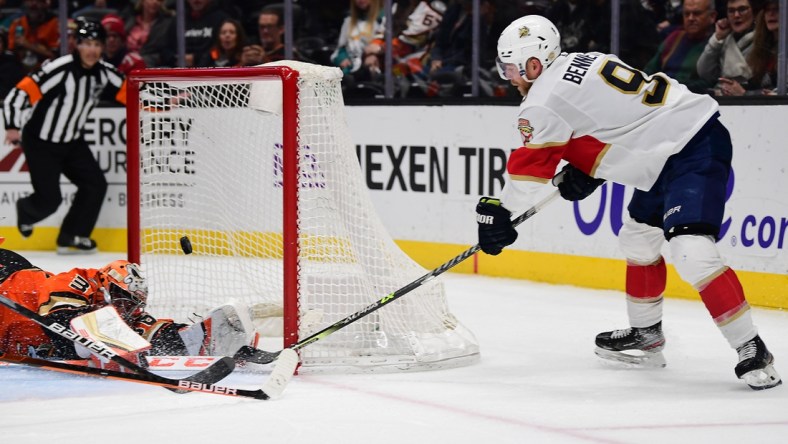 Mar 18, 2022; Anaheim, California, USA; Anaheim Ducks goaltender John Gibson (36) blocks a shot against Florida Panthers center Sam Bennett (9) during the third period at Honda Center. Mandatory Credit: Gary A. Vasquez-USA TODAY Sports