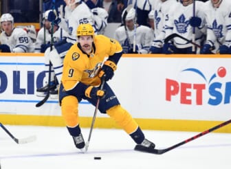 Mar 19, 2022; Nashville, Tennessee, USA; Nashville Predators left wing Filip Forsberg (9) handles the puck against the Toronto Maple Leafs during the first period at Bridgestone Arena. Mandatory Credit: Christopher Hanewinckel-USA TODAY Sports