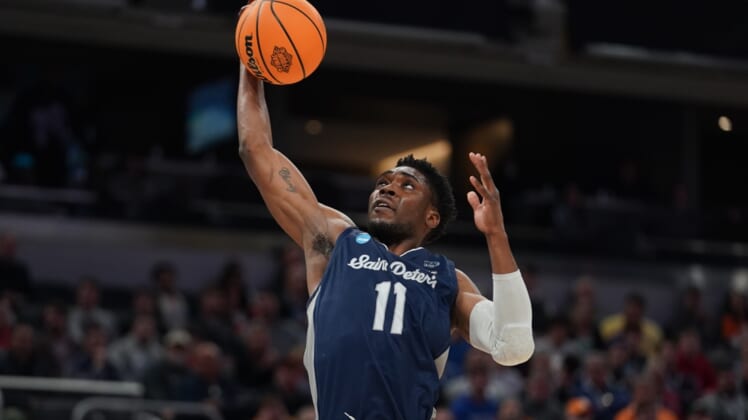Mar 19, 2022; Indianapolis, IN, USA; St. Peter's Peacocks forward KC Ndefo (11) controls the ball in the first half against the Murray State Racers during the second round of the 2022 NCAA Tournament at Gainbridge Fieldhouse. Mandatory Credit: Robert Goddin-USA TODAY Sports