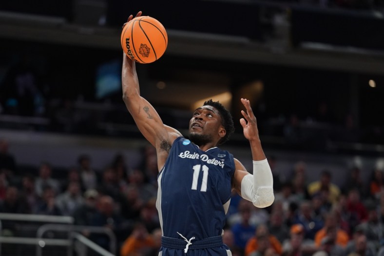 Mar 19, 2022; Indianapolis, IN, USA; St. Peter's Peacocks forward KC Ndefo (11) controls the ball in the first half against the Murray State Racers during the second round of the 2022 NCAA Tournament at Gainbridge Fieldhouse. Mandatory Credit: Robert Goddin-USA TODAY Sports
