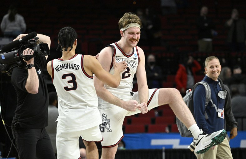 Mar 19, 2022; Portland, OR, USA; Gonzaga Bulldogs forward Drew Timme (2) and Gonzaga Bulldogs guard Andrew Nembhard (3) celebrate the win against Memphis Tigers 78-82 in the second round of the 2022 NCAA Tournament at Moda Center. Mandatory Credit: Troy Wayrynen-USA TODAY Sports
