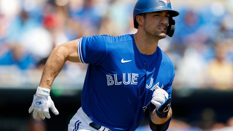 Mar 20, 2022; Dunedin, Florida, USA; Toronto Blue Jays right fielder Randal Grichuk (15) reacts after hitting a single in the first inning against the Pittsburgh Pirates during spring training at TD Ballpark. Mandatory Credit: Nathan Ray Seebeck-USA TODAY Sports