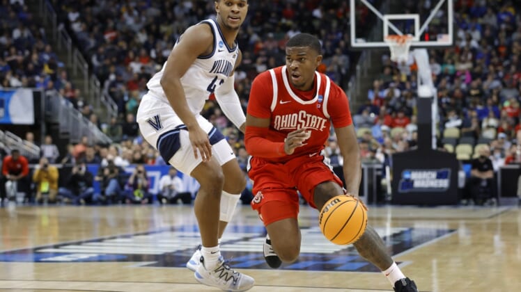 Mar 20, 2022; Pittsburgh, PA, USA; Ohio State Buckeyes forward E.J. Liddell (32) dribbles the ball around Villanova Wildcats forward Eric Dixon (43) in the first half during the second round of the 2022 NCAA Tournament at PPG Paints Arena. Mandatory Credit: Geoff Burke-USA TODAY Sports