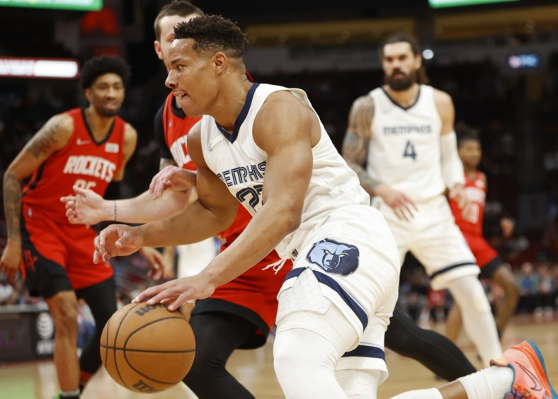 Mar 20, 2022; Houston, Texas, USA; Memphis Grizzlies guard Desmond Bane (22) drives with the ball during the first quarter against the Houston Rockets at Toyota Center. Mandatory Credit: Troy Taormina-USA TODAY Sports