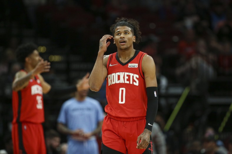 Mar 20, 2022; Houston, Texas, USA; Houston Rockets guard Jalen Green (0) reacts after a play during the first quarter against the Memphis Grizzlies at Toyota Center. Mandatory Credit: Troy Taormina-USA TODAY Sports