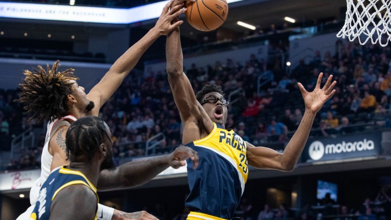 Mar 20, 2022; Indianapolis, Indiana, USA;  Indiana Pacers forward Jalen Smith (25) rebounds the ball in the first half against the Portland Trail Blazers at Gainbridge Fieldhouse. Mandatory Credit: Trevor Ruszkowski-USA TODAY Sports