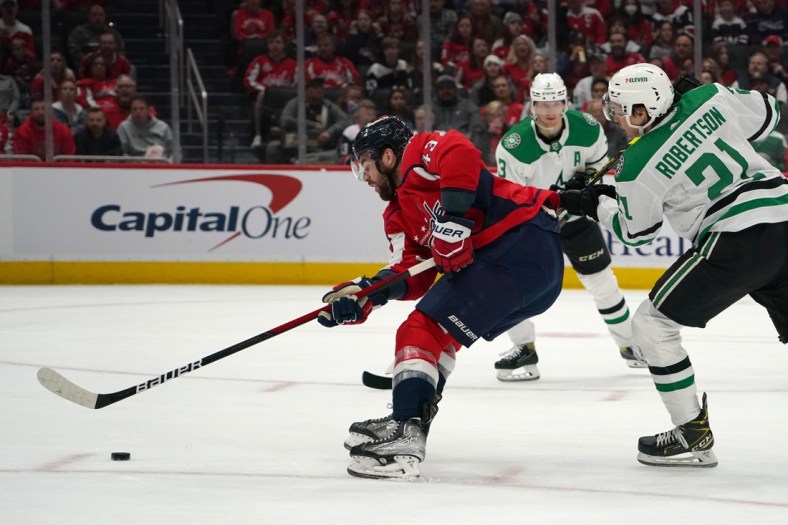 Mar 20, 2022; Washington, District of Columbia, USA; Washington Capitals right wing Tom Wilson (43) attempts an unsuccessful shot against the Dallas Stars in the first period at Capital One Arena. Mandatory Credit: Mitch Stringer-USA TODAY Sports