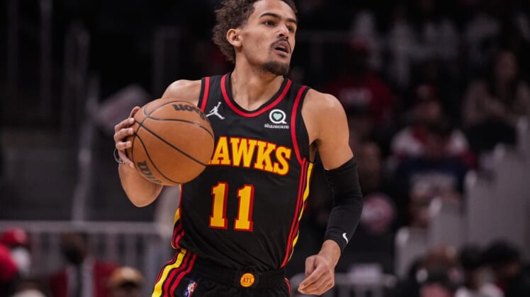 Mar 20, 2022; Atlanta, Georgia, USA; Atlanta Hawks guard Trae Young (11) brings the ball up the court against the New Orleans Pelicans during the first half at State Farm Arena. Mandatory Credit: Dale Zanine-USA TODAY Sports