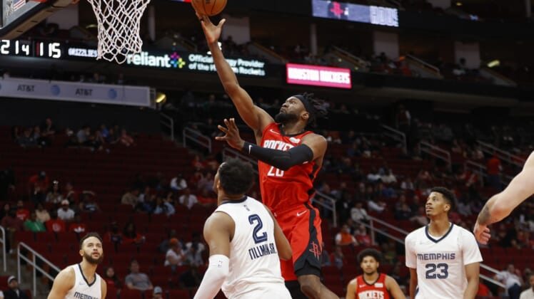 Mar 20, 2022; Houston, Texas, USA; Houston Rockets forward Bruno Fernando (20) shoots the ball during the fourth quarter against the Memphis Grizzlies at Toyota Center. Mandatory Credit: Troy Taormina-USA TODAY Sports