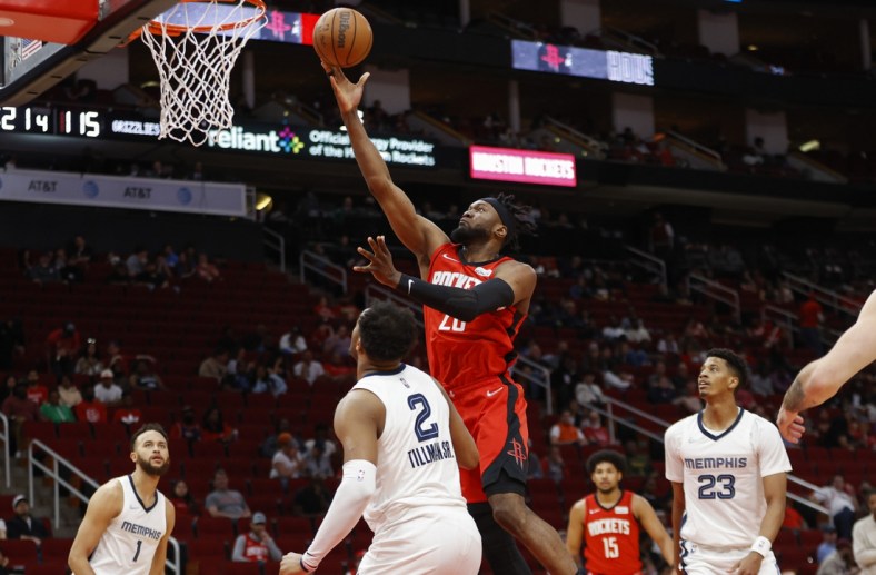 Mar 20, 2022; Houston, Texas, USA; Houston Rockets forward Bruno Fernando (20) shoots the ball during the fourth quarter against the Memphis Grizzlies at Toyota Center. Mandatory Credit: Troy Taormina-USA TODAY Sports