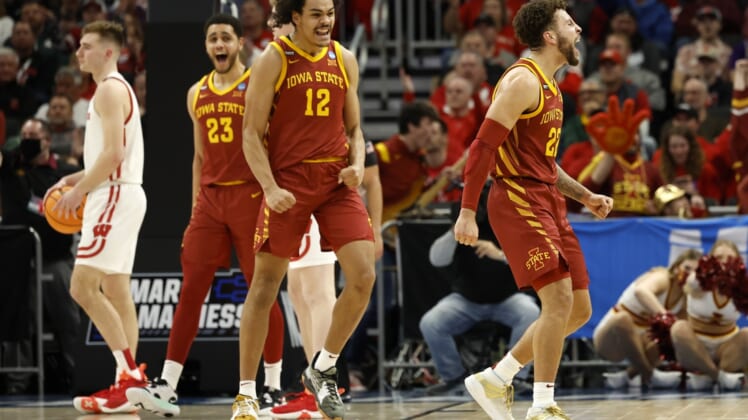 Mar 20, 2022; Milwaukee, WI, USA; Iowa State Cyclones guard Gabe Kalscheur (22) and Iowa State Cyclones forward Robert Jones (12) react to a play during the second half against Wisconsin Badgers in the second round of the 2022 NCAA Tournament at Fiserv Forum. Mandatory Credit: Jeff Hanisch-USA TODAY Sports