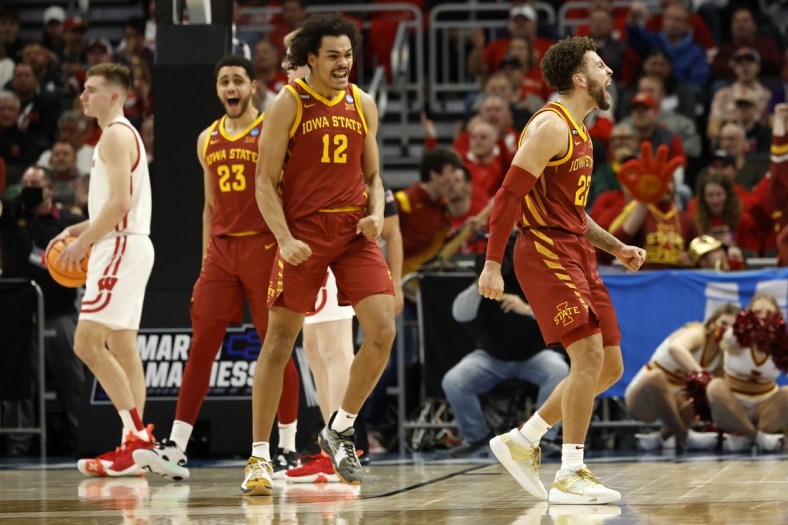 Mar 20, 2022; Milwaukee, WI, USA; Iowa State Cyclones guard Gabe Kalscheur (22) and Iowa State Cyclones forward Robert Jones (12) react to a play during the second half against Wisconsin Badgers in the second round of the 2022 NCAA Tournament at Fiserv Forum. Mandatory Credit: Jeff Hanisch-USA TODAY Sports
