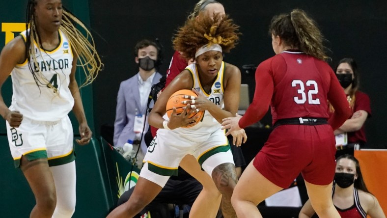 Mar 20, 2022; Waco, Texas, USA;  Baylor Lady Bears forward NaLyssa Smith (1) grabs a rebound against South Dakota Coyotes guard Kyah Watson (32) during the second half at Ferrell Center. Mandatory Credit: Chris Jones-USA TODAY Sports