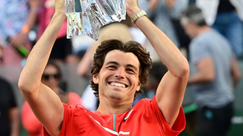 Mar 20, 2022; Indian Wells, CA, USA;   Taylor Fritz (USA) holds the championship trophy after defeating Rafael Nadal (ESP) in the men   s final at the BNP Paribas Open at the Indian Wells Tennis Garden. Mandatory Credit: Jayne Kamin-Oncea-USA TODAY Sports