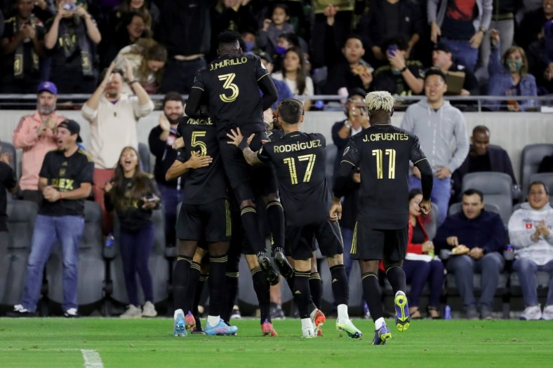 Mar 20, 2022; Los Angeles, California, USA; Los Angeles FC defender Jesus Murillo (3) celebrates with teammates after midfielder Ryan Hollingshead (24) scores a goal during the first half against the Vancouver Whitecaps FC at Banc of California Stadium. Mandatory Credit: Kiyoshi Mio-USA TODAY Sports