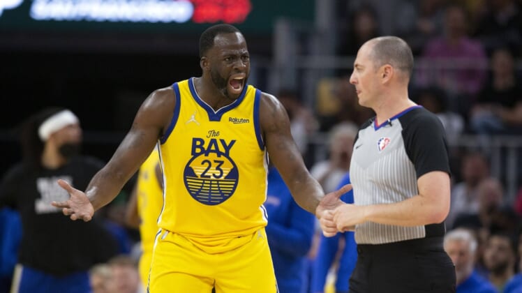 Mar 20, 2022; San Francisco, California, USA; Golden State Warriors forward Draymond Green (23) has words with referee Marat Kogut after he was assessed a second technical foul and ejected from the game during the third quarter against the San Antonio Spurs at Chase Center. Mandatory Credit: D. Ross Cameron-USA TODAY Sports