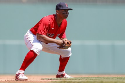 Mar 21, 2022; Fort Myers, Florida, USA; Boston Red Sox third baseman Rafael Devers (11) plays his position in the second inning of the game against the Atlanta Braves during spring training at JetBlue Park at Fenway South. Mandatory Credit: Sam Navarro-USA TODAY Sports