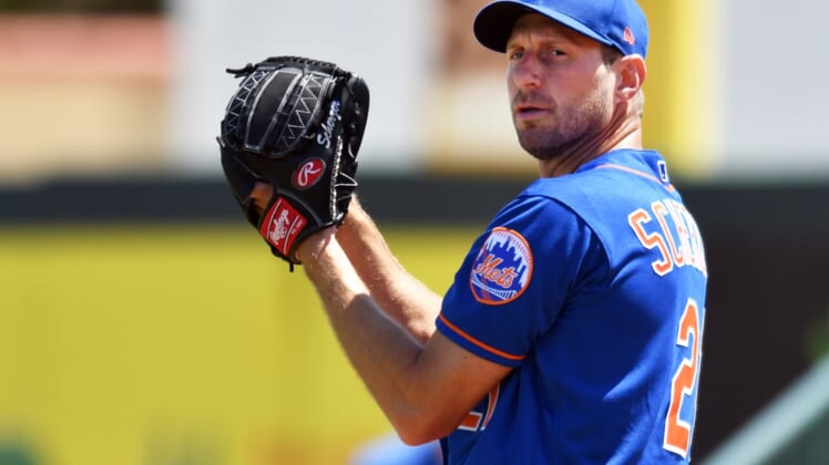 Mar 21, 2022; Jupiter, Florida, USA; Max Scherzer (21) of the New York Mets warms up before a spring training game against the Miami Marlins at Roger Dean Stadium. Mandatory Credit: Jim Rassol-USA TODAY Sports