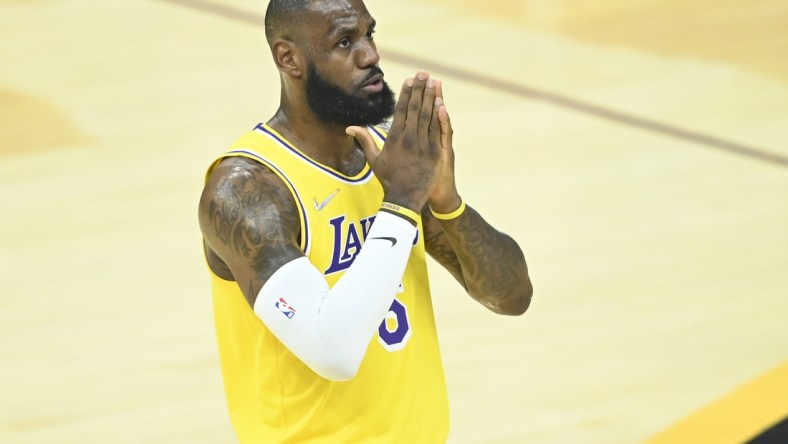 Mar 21, 2022; Cleveland, Ohio, USA; Los Angeles Lakers forward LeBron James (6) reacts to cheers in the first quarter against the Cleveland Cavaliers at Rocket Mortgage FieldHouse. Mandatory Credit: David Richard-USA TODAY Sports