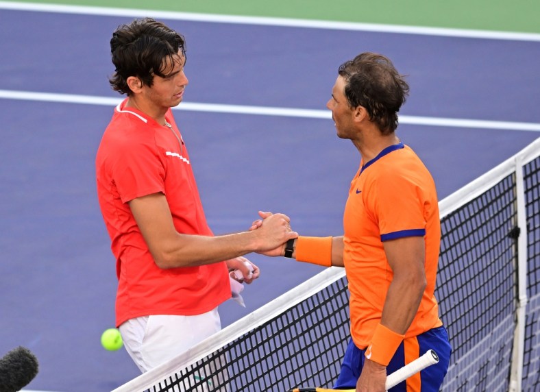 Mar 20, 2022; Indian Wells, CA, USA;   Taylor Fritz (USA) shakes hands with Rafael Nadal (ESP) after winning the men's final at the BNP Paribas Open at the Indian Wells Tennis Garden. Mandatory Credit: Jayne Kamin-Oncea-USA TODAY Sports