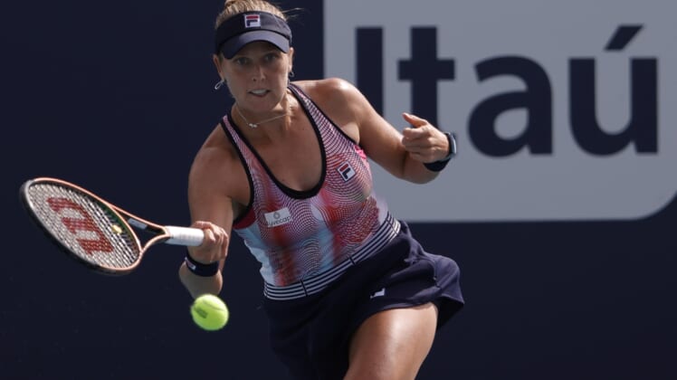 Mar 22, 2022; Miami Gardens, FL, USA; Shelby Rogers of the United States hits a forehand against Amanda Anisimova of the United States (not pictured) in a first round women's singles match in the Miami Open at Hard Rock Stadium. Mandatory Credit: Geoff Burke-USA TODAY Sports