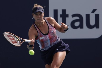 Mar 22, 2022; Miami Gardens, FL, USA; Shelby Rogers of the United States hits a forehand against Amanda Anisimova of the United States (not pictured) in a first round women's singles match in the Miami Open at Hard Rock Stadium. Mandatory Credit: Geoff Burke-USA TODAY Sports