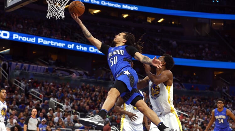 Mar 22, 2022; Orlando, Florida, USA; Orlando Magic guard Cole Anthony (50) makes a layup against the Golden State Warriors during the second half at Amway Center. Mandatory Credit: Kim Klement-USA TODAY Sports