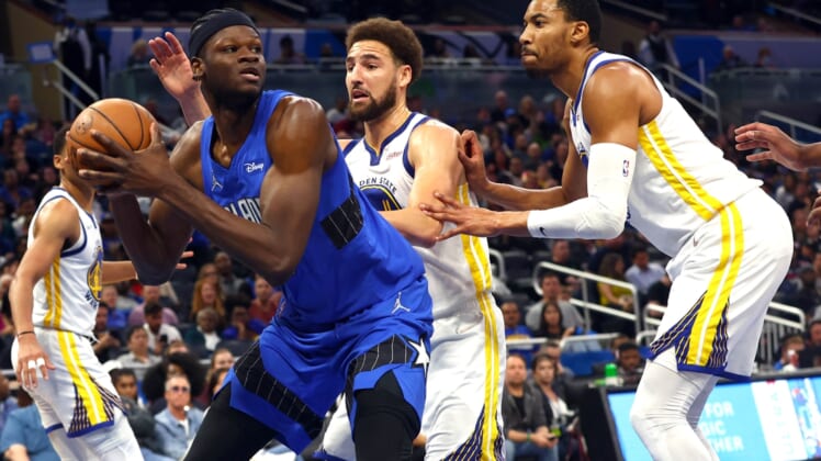 Mar 22, 2022; Orlando, Florida, USA; Orlando Magic center Mo Bamba (5) drives to the basket as Golden State Warriors guard Klay Thompson (11) defends during the second half at Amway Center. Mandatory Credit: Kim Klement-USA TODAY Sports