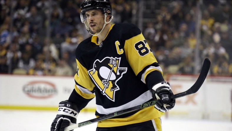 Mar 22, 2022; Pittsburgh, Pennsylvania, USA;  Pittsburgh Penguins center Sidney Crosby (87) looks on against the Columbus Blue Jackets during the third period at PPG Paints Arena. The Penguins won 5-1. Mandatory Credit: Charles LeClaire-USA TODAY Sports