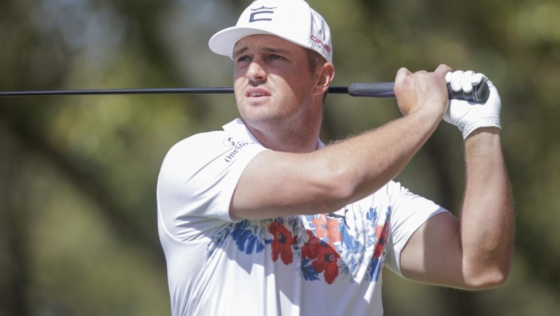 Mar 23, 2022; Austin, Texas, USA; Bryson DeChambeau tees off on #8 during the first round of the World Golf Championships-Dell Technologies Match Play golf tournament. Mandatory Credit: Erich Schlegel-USA TODAY Sports